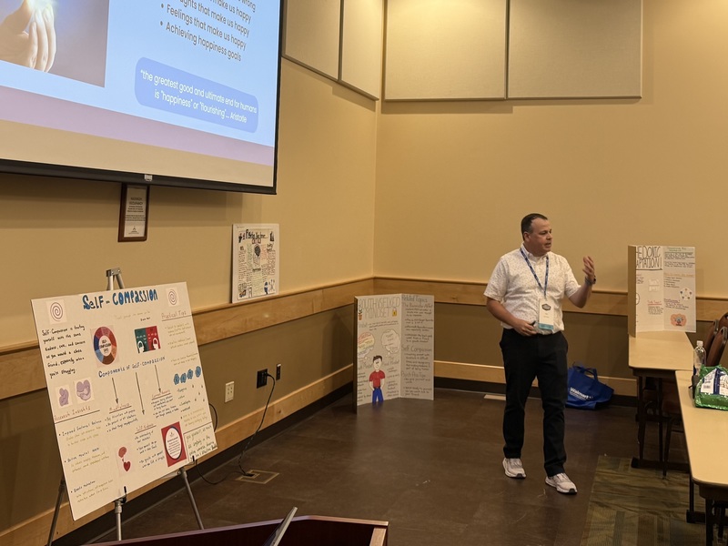 Science of Well-Being teacher presents to audience