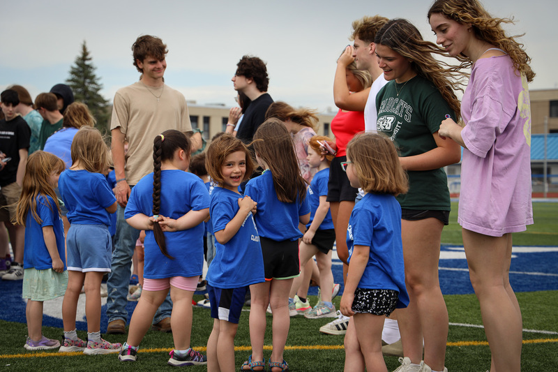 students talking on field