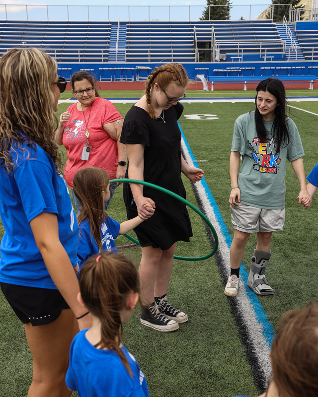 students playing with hula hoops