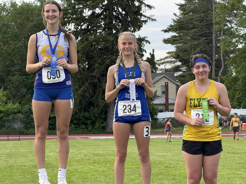 Chloe Harper standing on podium