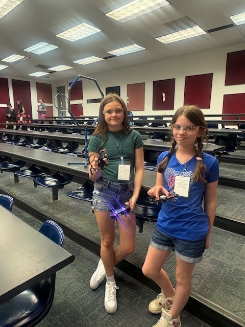 students holding drones